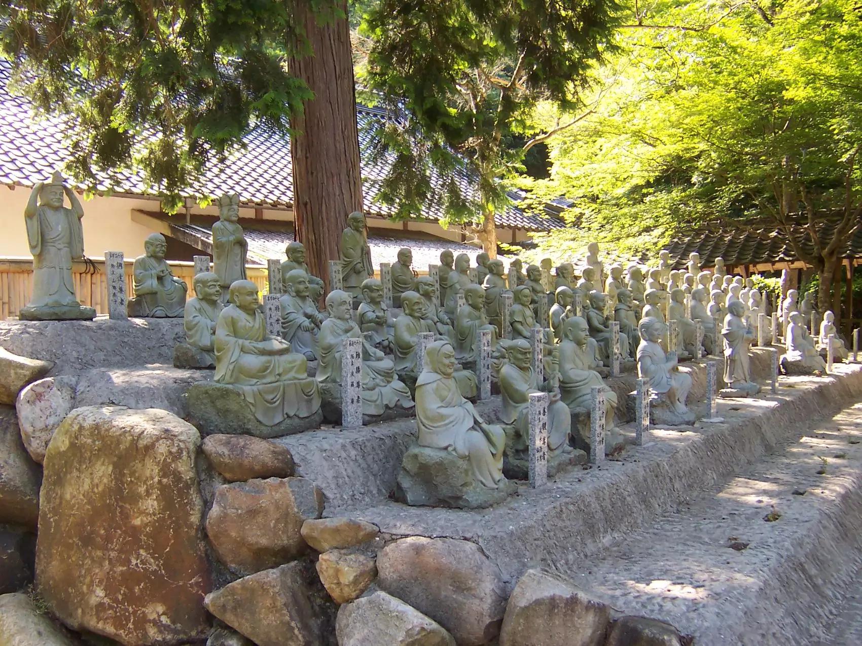 Small stone stones of past abbots in the garden at Butsuji Temple, Japan.